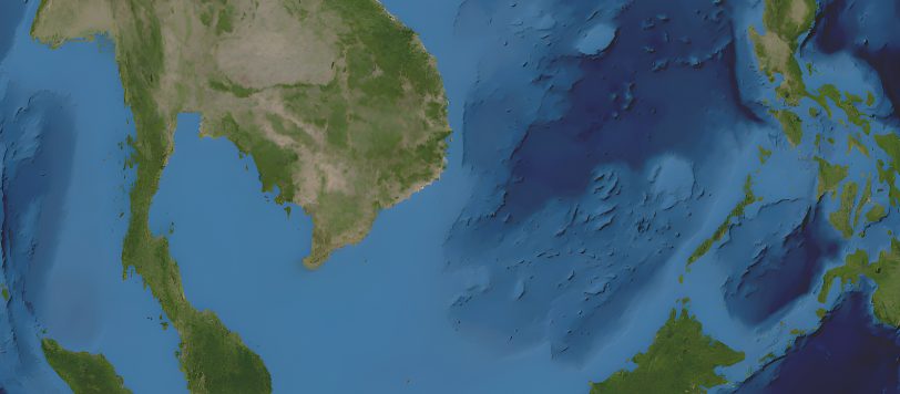 Satellite-style map showing Southeast Asia and the surrounding seas, focusing on the South China Sea and the West Philippine Sea. The map includes parts of China, Vietnam, Thailand, Malaysia, Indonesia, the Philippines, and Borneo. The land areas are shown in green and brown tones, while the ocean depths are represented in varying shades of blue, illustrating underwater topography.